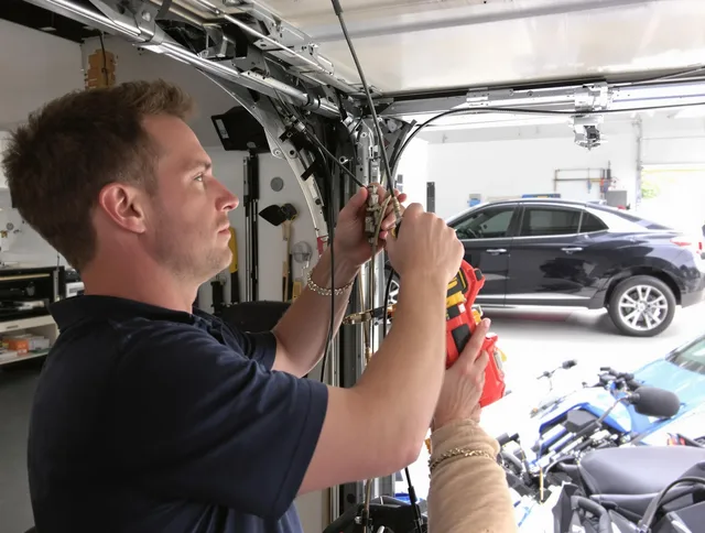 South Euclid Garage Door Repair safety certified technician performing cable replacement in South Euclid