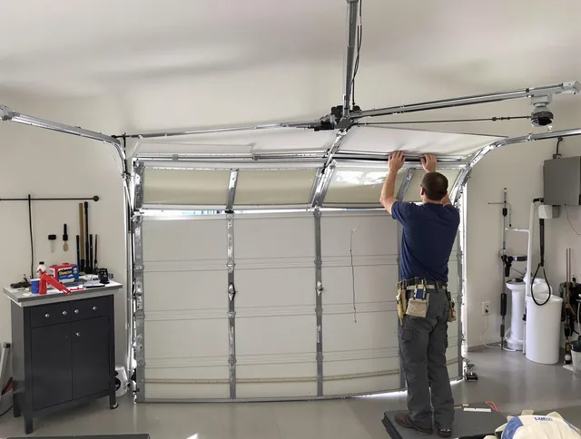 South Euclid Garage Door Repair specialist performing precise section replacement on South Euclid garage door